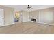 Spacious main bedroom featuring a modern fireplace, ceiling fan, and ensuite bathroom at 7607 N 42Nd Ln, Phoenix, AZ 85051