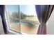 Backyard view shows a pool, grassy lawn and privacy fence at 8541 W Pershing Ave, Peoria, AZ 85381