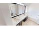 Bathroom featuring double sinks, large mirror, soaking tub, and tile flooring at 8541 W Pershing Ave, Peoria, AZ 85381