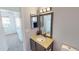 Bathroom with a vanity, decorative mirror and carpeted floor in adjacent room at 8541 W Pershing Ave, Peoria, AZ 85381