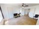 Bright bedroom featuring two doors, carpet floors, and a ceiling fan at 8541 W Pershing Ave, Peoria, AZ 85381