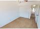 This bedroom features neutral carpet, white walls, and a closet with sliding doors at 8541 W Pershing Ave, Peoria, AZ 85381