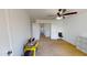 A carpeted bedroom offers multiple doors, ceiling fan and lots of space at 8541 W Pershing Ave, Peoria, AZ 85381
