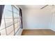 Bedroom featuring a large window with sheer curtains and a ceiling fan at 8541 W Pershing Ave, Peoria, AZ 85381