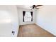 This bedroom has neutral carpet, white walls, and a ceiling fan at 8541 W Pershing Ave, Peoria, AZ 85381