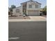 Charming two-story home showcasing a well-maintained front yard and attached two-car garage at 8541 W Pershing Ave, Peoria, AZ 85381