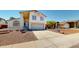 Inviting two-story home featuring a spacious driveway and desert landscaping at 8541 W Pershing Ave, Peoria, AZ 85381
