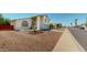Charming two-story home with gravel landscaping and a well-manicured lawn, on a sunny corner lot at 8541 W Pershing Ave, Peoria, AZ 85381