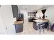Modern kitchen with dark cabinetry, tiled floors, and ample counter space perfect for cooking at 8541 W Pershing Ave, Peoria, AZ 85381