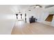 Spacious living room featuring wood floors, high ceilings, ceiling fans and access to stairs at 8541 W Pershing Ave, Peoria, AZ 85381