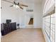 Bright and spacious living room with high ceilings and a grand staircase visible through French doors at 8541 W Pershing Ave, Peoria, AZ 85381