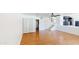 Spacious living room featuring hardwood floors, staircase, and adjacent kitchen at 8541 W Pershing Ave, Peoria, AZ 85381