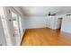 Bright living area featuring hardwood floors, ceiling fan, and access to backyard at 8541 W Pershing Ave, Peoria, AZ 85381