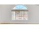 Large arched window offers scenic views, enhancing natural light within the interior space at 8541 W Pershing Ave, Peoria, AZ 85381