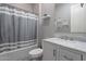 Neutral bathroom featuring a tub/shower, a marble topped vanity and decorative mirror at 9345 W Robin Ln, Peoria, AZ 85383