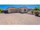 Paver driveway leading to a spacious three-car garage, complementing the home's exterior at 9345 W Robin Ln, Peoria, AZ 85383