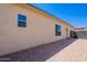 Neutral home exterior with desert landscaping and brick-paver sidewalk leading to a side entrance at 9345 W Robin Ln, Peoria, AZ 85383
