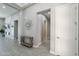 Bright foyer with neutral color palette, decorative mirror, and views into other rooms at 9345 W Robin Ln, Peoria, AZ 85383