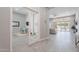 Spacious hallway showcases modern tile flooring and leads into a light-filled living area with outdoor access at 9345 W Robin Ln, Peoria, AZ 85383