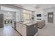 Spacious kitchen with granite counters, island with seating, and stainless steel appliances at 9345 W Robin Ln, Peoria, AZ 85383