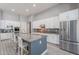 Modern kitchen with white cabinetry, granite countertops, stainless steel appliances, and ample counter space at 9345 W Robin Ln, Peoria, AZ 85383