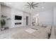 Comfortable living room with modern fireplace feature wall, neutral colors, and ample seating at 9345 W Robin Ln, Peoria, AZ 85383
