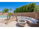 Backyard patio with outdoor seating and lush greenery, ideal for relaxing outdoors at 9345 W Robin Ln, Peoria, AZ 85383