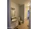 Well-lit bathroom featuring granite counters, a single sink vanity, and tile flooring at 10006 N 7Th Pl, Phoenix, AZ 85020