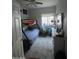Cozy bedroom featuring bunk beds, bright window for natural light and plush carpeting at 10006 N 7Th Pl, Phoenix, AZ 85020