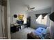 Comfortable bedroom featuring neutral paint, plush carpeting, and bright window for natural light at 10006 N 7Th Pl, Phoenix, AZ 85020