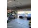 Spacious two-car garage, with overhead door, built-in storage shelves, and epoxy flooring at 10006 N 7Th Pl, Phoenix, AZ 85020
