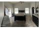 Spacious bedroom with vaulted ceilings, slider door, neutral color palette, and a ceiling fan at 10006 N 7Th Pl, Phoenix, AZ 85020