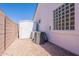 The exterior view highlights a practical storage shed and efficient AC unit, enhancing home functionality at 1062 N Robin Ln, Mesa, AZ 85213