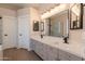 Elegant bathroom with double vanity, quartz countertops, and modern fixtures at 1062 N Robin Ln, Mesa, AZ 85213