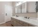 Bathroom featuring a double sink vanity with marble countertop at 1062 N Robin Ln, Mesa, AZ 85213