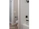 Bathroom with white subway tile, a bathtub, and matte black shower head and fixtures at 1062 N Robin Ln, Mesa, AZ 85213