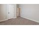 Bright bedroom with neutral carpet and white trim at 1062 N Robin Ln, Mesa, AZ 85213