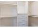 Organized walk-in closet with shelving and drawers offers ample storage space at 1062 N Robin Ln, Mesa, AZ 85213