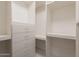 Organized walk-in closet featuring ample shelving and drawer space at 1062 N Robin Ln, Mesa, AZ 85213