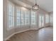 Dining area with shutter shades and modern light fixture at 1062 N Robin Ln, Mesa, AZ 85213