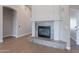 Living room fireplace with gray tile and white surround at 1062 N Robin Ln, Mesa, AZ 85213