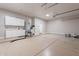 Spacious garage featuring ample storage cabinets, epoxy floors, and room for multiple vehicles at 1062 N Robin Ln, Mesa, AZ 85213