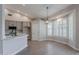 Eat-in kitchen features stainless steel appliances, white countertops, and light gray cabinets at 1062 N Robin Ln, Mesa, AZ 85213