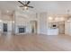 Open-concept living room with high ceilings, fireplace, and open to kitchen and dining at 1062 N Robin Ln, Mesa, AZ 85213