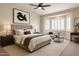 Serene main bedroom featuring a plush bed, a bay window, and tasteful decor for a relaxing retreat at 1062 N Robin Ln, Mesa, AZ 85213