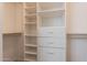 Well-organized walk-in closet with custom shelving and drawer units at 1062 N Robin Ln, Mesa, AZ 85213