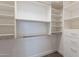 Spacious walk-in closet with custom shelving and rods for optimal organization at 1062 N Robin Ln, Mesa, AZ 85213