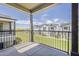 Scenic view from a private balcony overlooking a green space and neighborhood homes at 11300 N Casa Dega Dr # 1019, Surprise, AZ 85388
