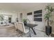 Stylish dining room with contemporary decor, plants, and a view of the living area at 11300 N Casa Dega Dr # 1019, Surprise, AZ 85388