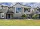 Charming two-story home with a well-manicured lawn and inviting front porch at 11300 N Casa Dega Dr # 1019, Surprise, AZ 85388